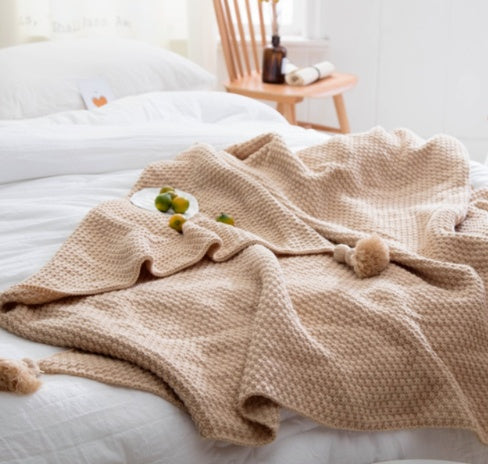 Manta nórdica de malha em acrílico com franjas – moderna e macia com um toque de lã, ideal para sofá e escritório.